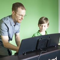 Teacher and student at piano